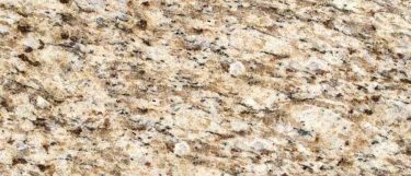 a Giallo Ornamental granite countertop surface that features dark gray and brown veining design over the creamy white background