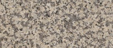 a Giallo Atlantico granite countertop surface that combines colors of dark and light yellow with hints of cream colors