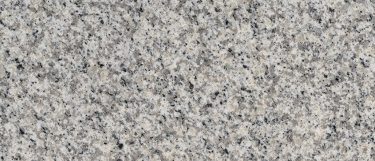 a Fortaleza granite countertop surface with black and beige speckles over the light gray background