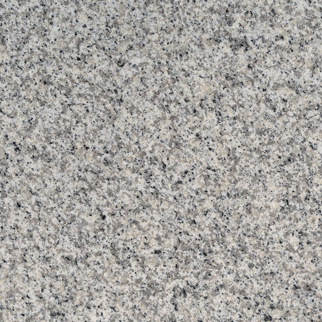 a Fortaleza granite countertop surface with black and beige speckles over the light gray background