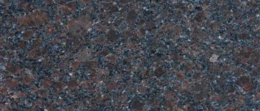 a coffee brown granite countertop surface that has a reddish black background with dark brown details