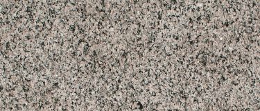 a Caledonia granite countertop surface that features shades of white and grays