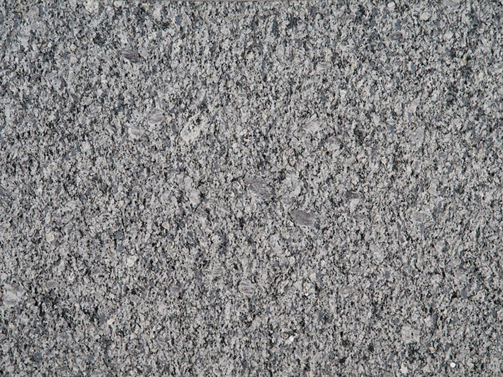 a Blue Ice granite countertop surface that features icy blue colors with specks and flecks in gray, white, and blue