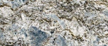 a Blue Flower granite countertop surface that features white base swirled with blue and brown with white patches details with blue flecks scattered throughout