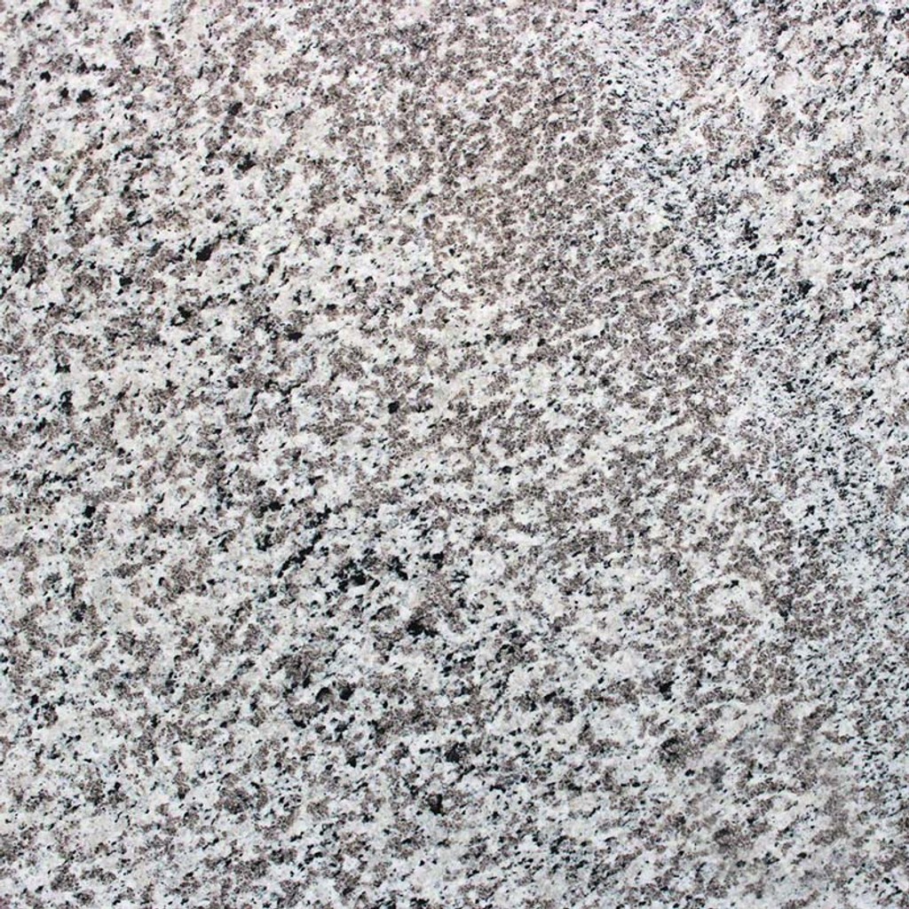 a Blanco Perla countertop surface that features black and cream specks over the pearl white background