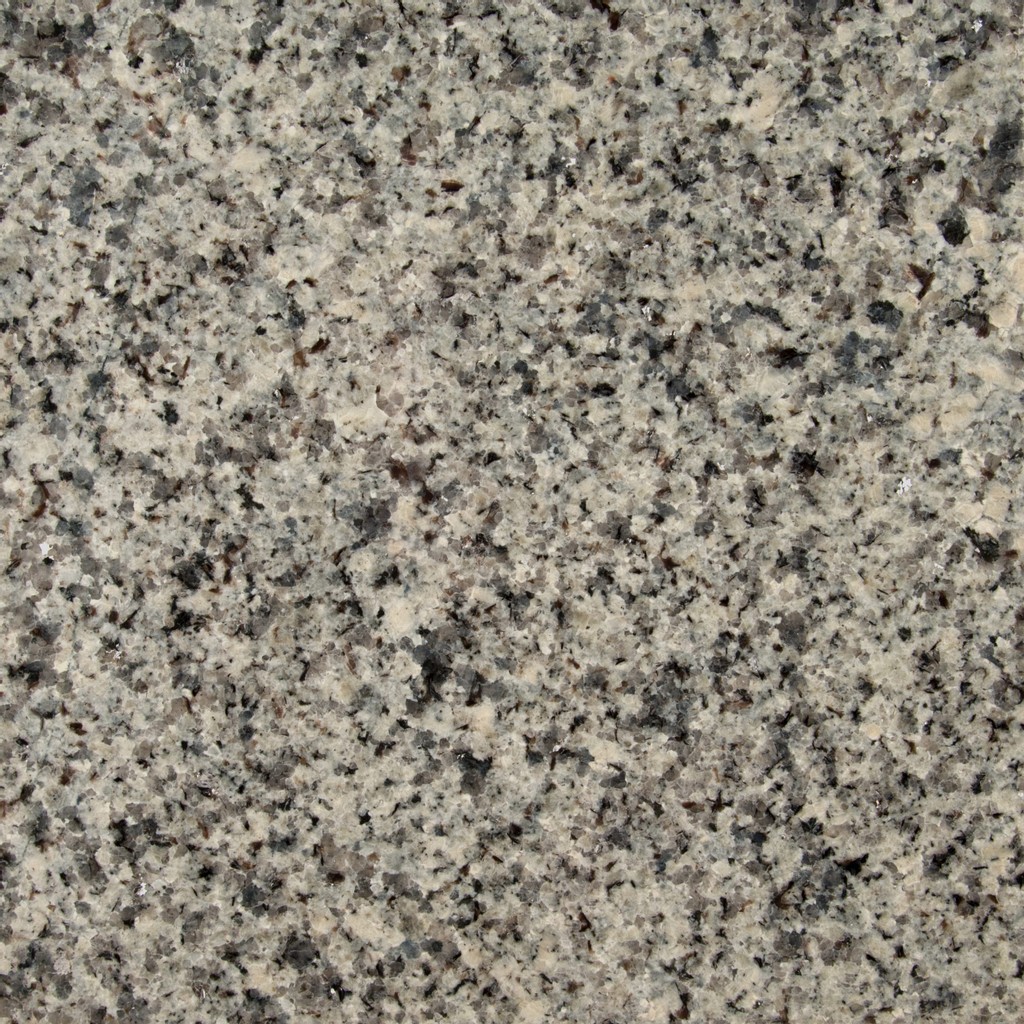 an Azul Platino granite countertop surface that has a light gray color with black and gray specks