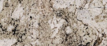 an Avalon White granite countertop surface that features cream tones with black and gray tones over the warm white background