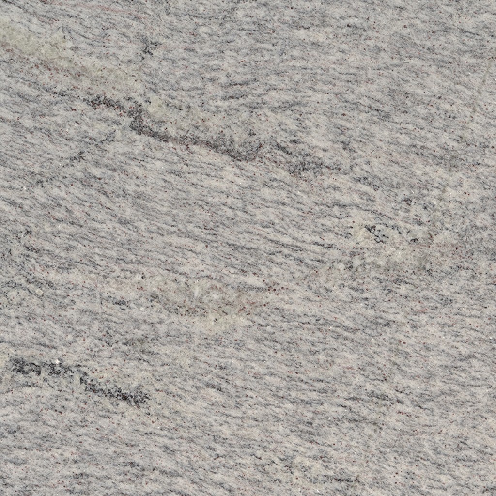 an Arctic Valley granite countertop surface that features sprinkles of gray and black speckles over the white background