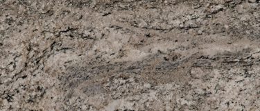 an Arctic Sand countertop surface that features soft beige, taupe, and black blended together