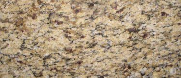 an Amber Yellow granite countertop surface that features warm gold and yellow colors with details of gray and dark brown veins