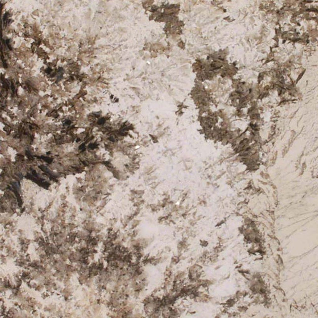 an Alpine White granite countertop surface that features brown flecks over the creamy white background