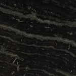 an Agatha Black granite countertop surface that features light gray and white wavy veins over the dark black background