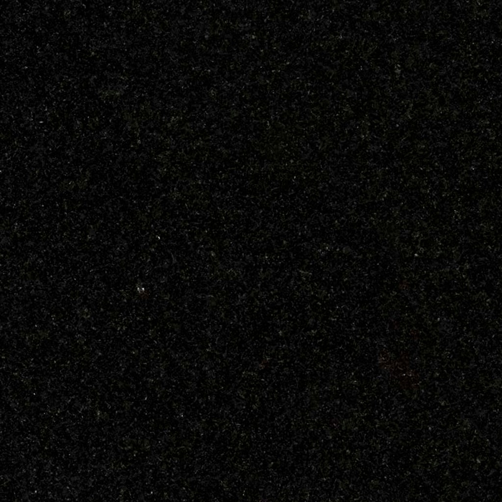 an Absolute Black granite countertop surface that has an intense black color with subtle speck details