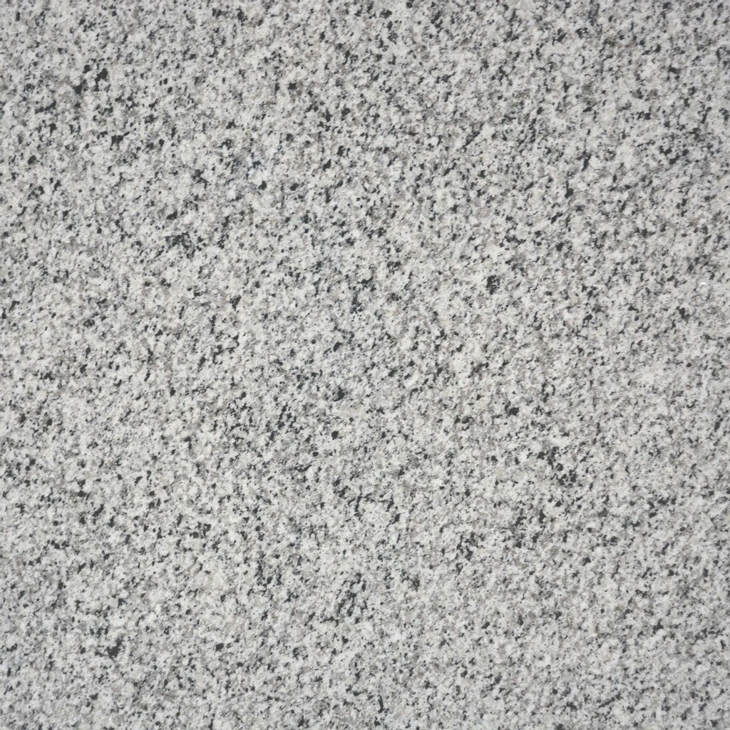 a palladium white granite countertop surface that has gray details over the white base