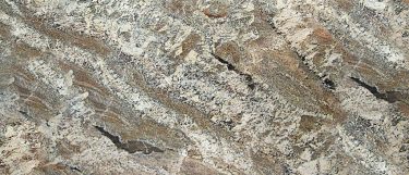a Netuno Bordeaux granite countertop that has a gold, beige, black, and green colors over its surface