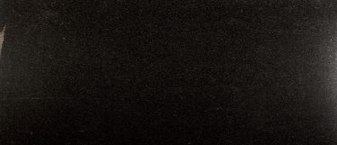 a Black Pearl granite countertop surface that features black, gold, solver, brown, green, and gray speckles over the black background