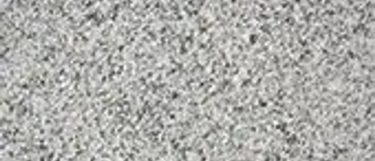 an Ashen White granite countertop surface that features gray specks over white background