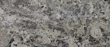 an Alaska White granite countertop surface that features a design that has a frosty blend of silver and white with warm neutral hues