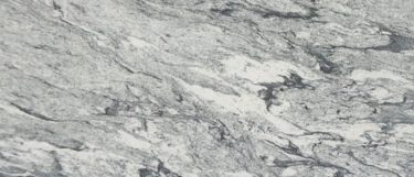 a viscount white granite countertop that features swirls of white, gray, and black hues throughout the surface