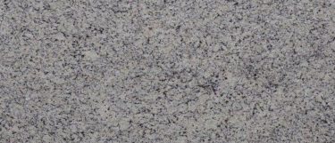 a venetian white granite countertop surface that features a small grained ivory-cream design