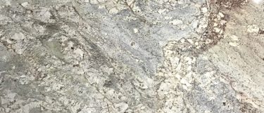 a typhoon bordeaux granite countertop surface that has a brown background with beige and gold veins