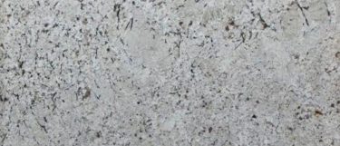a snow fall granite countertop surface that has a warm design with shades of gray, white, and taupe