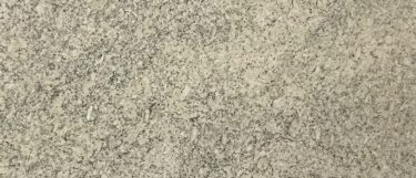 a santa cecilia granite countertop surface that blends warm colors of yellow, gold, black, and burgundy