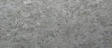 a salinas white granite countertop surface that has a snowy white base and gray speckles