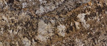 a persa brown granite countertop surface that has taupe and various shade of brown smattering over the cream background