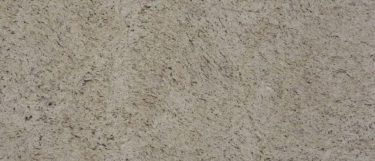 a Guidoni Ornamental granite countertop surface that has a creamy ivory color with flecks of brown and black