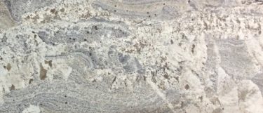 an Azul Nuevo granite countertop surface that blends together colors of beige, white, and gray