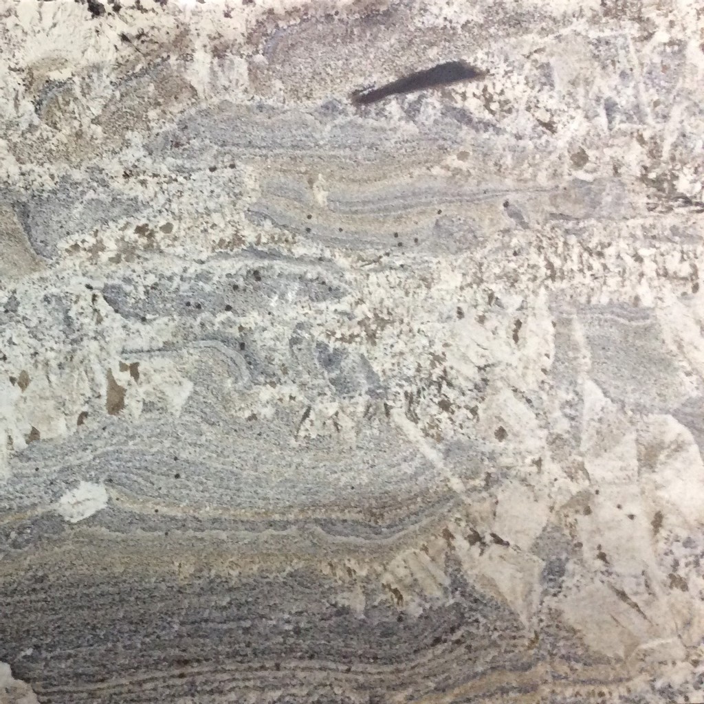 an Azul Nuevo granite countertop surface that blends together colors of beige, white, and gray
