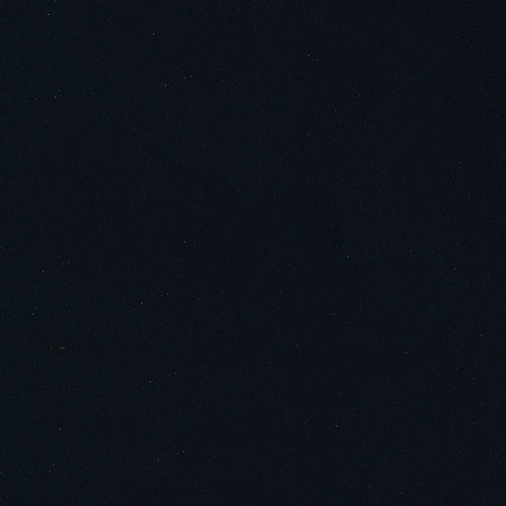 an Absolute Black granite countertop surface that has an intense black color with subtle speck details