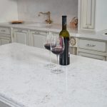 a bottle and glasses of wine over the Akoya countertop surface