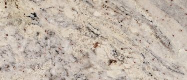 White ravine granite countertop surface that has a cool white background with rivers of whites and grays with specks of black and brown