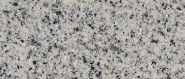 a white pearl granite countertop surface that has black and gray specks mixed with light cool whites