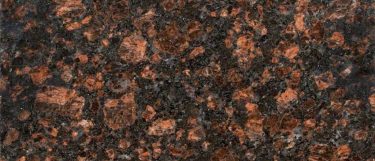 tan brown granite countertop that has a dark brown surface with accents of brown, black, and gray flecks