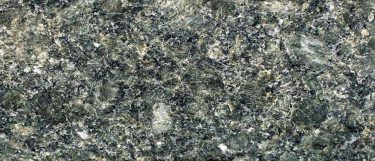 an Emerald Green granite countertop surface that features shades of greens, browns, white, and gold
